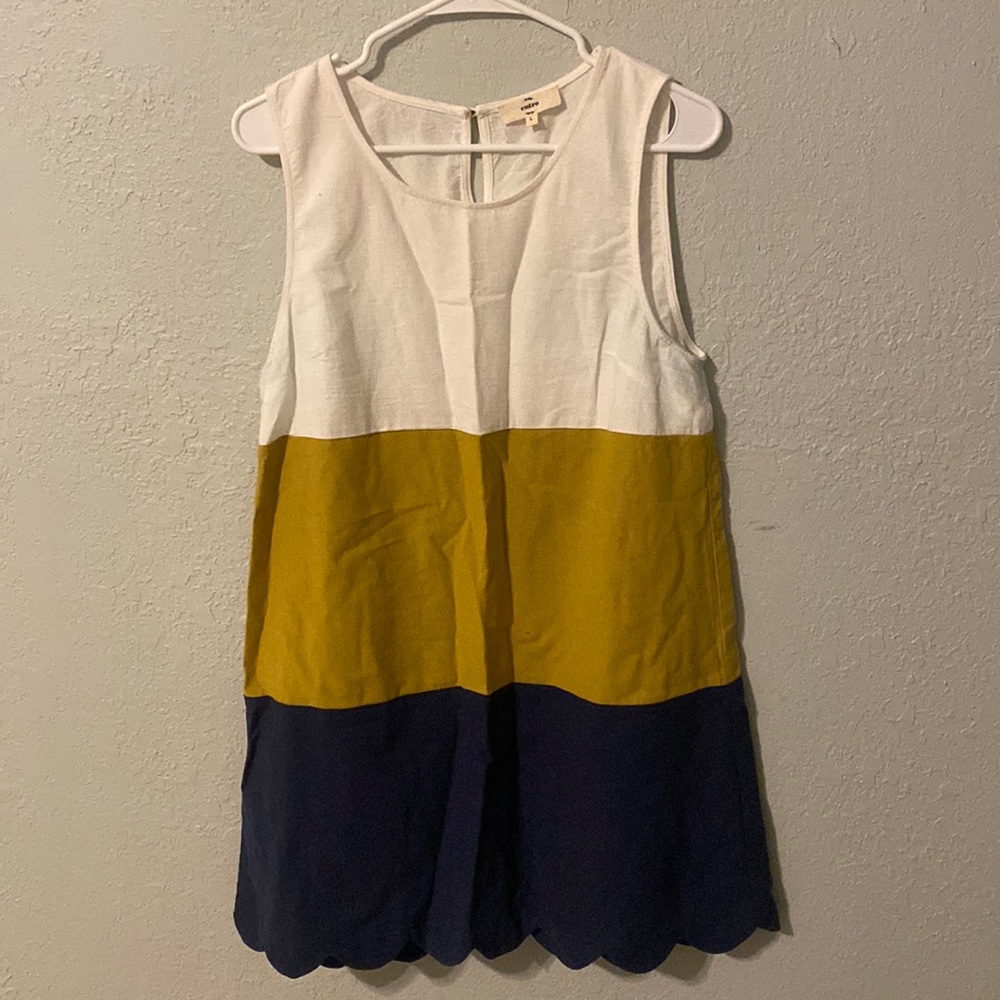 Blue, gold, and white sleeveless dress